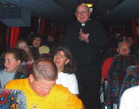 photo of Bishop Bullock in bus with World-Youth-Day-bound young adults from Madison Diocese