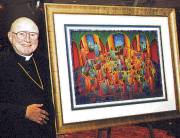 photo of Bishop Bullock with painting to be hung in Catholic Multicultural Center