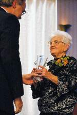 photo of Brian Cain giving award to Jane Wood