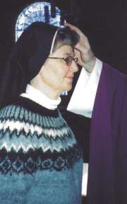 photo of Sr. Teresa Ann Wolf receiving the mark of ashes