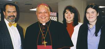 photo of Bishop Morlino with Smillie family