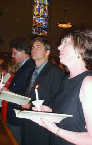 photo of people holding candles during Vespers Service