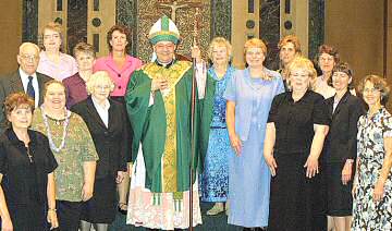 photo of Bishop Morlino and 14 people newly certified for lay ministry in Diocese of Madison