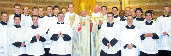 photo of two newly ordained priests for Diocese of Madison with Bishop Morlino, Fr. Bartylla and others