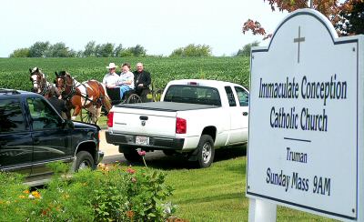 photo of horse and buggy on the way to a Mass celebrating the sesquicentennial of Immaculate Conception Parish in Truman, Wisconsin