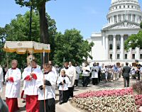 photo of Corpus Christi Procession leaving the state Capitol on its way to the St. Raphael Cathedral site on Sunday, June 10