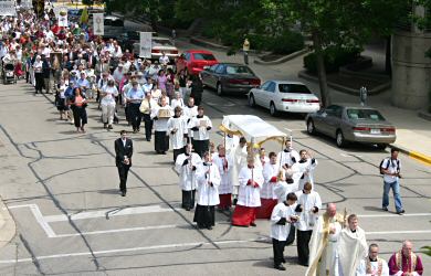 photo of Corpus Christi Procession proceeding up Main St. in downtown Madison towards the state Capitol on Sunday, June 10