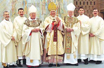 photo of four Madison diocesan seminarians who were ordained transitional deacons on June 1, 2007, standing with Bishop Bullock, Bishop Morlino and Bishop Wirz
